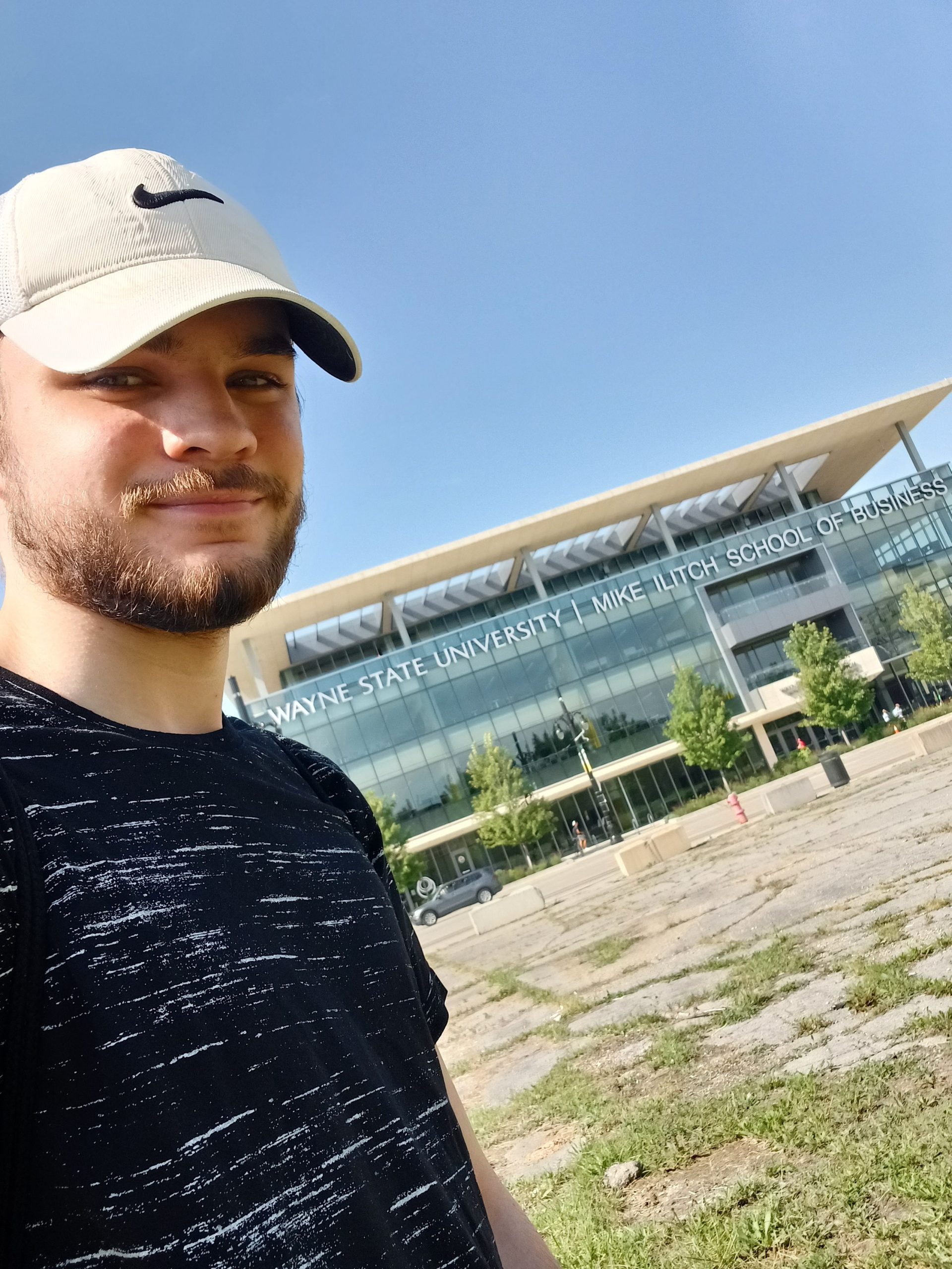 Dylan in front of Wayne State Universitiy's Mike Ilitch School of Business